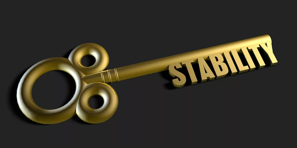 Old-styled key with the word "stability" for its teeth